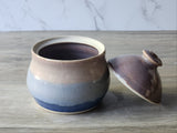 Handmade ceramic sugar bowl with lid removed showing interior glaze