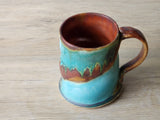 “Handmade ceramic mug with turquoise blue and earthy rust glaze, Buxton Pottery Melbourne