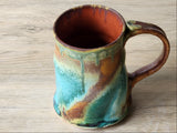 Wheel-thrown ceramic mug photographed from above showing glazed interior