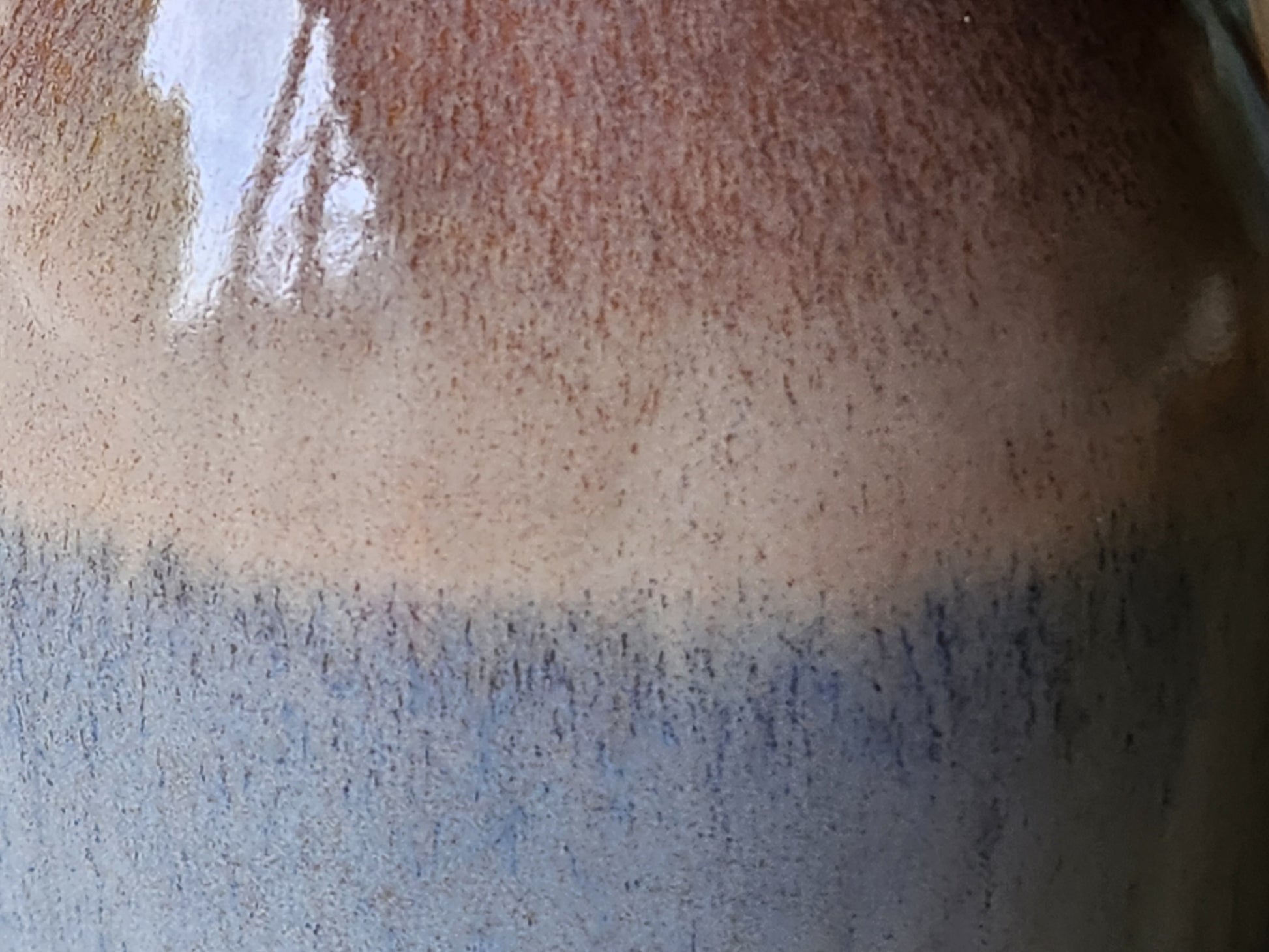 Close-up of oatmeal and blue glaze on handmade ceramic bud vase, handmade pottery Melbourne Australia