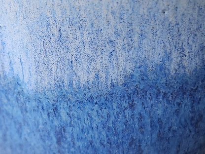 Close-up of  blue glaze on handmade ceramic bud vase, handmade pottery Melbourne Australia