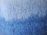 Close-up of  blue glaze on handmade ceramic bud vase, handmade pottery Melbourne Australia