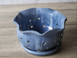 Blue handmade ceramic strawberry bowl with scalloped rim and drainage holes