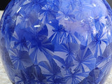 Close up detail of cobalt blue crystalline bud vase, glossy handmade pottery glaze