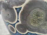 Macro shot of glaze crystals and speckled “star field” effect on handmade Australian pottery vase