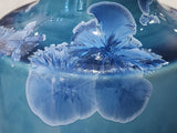Close-up of crystalline glaze detail on blue ceramic bottle vase, one-of-a-kind pottery