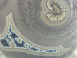 Close-up of vase showing crystalline glaze texture and high-gloss finish, studio ceramics