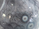 Detail shot of crystalline glaze cells and layered night-sky tones on decorative ceramic vase