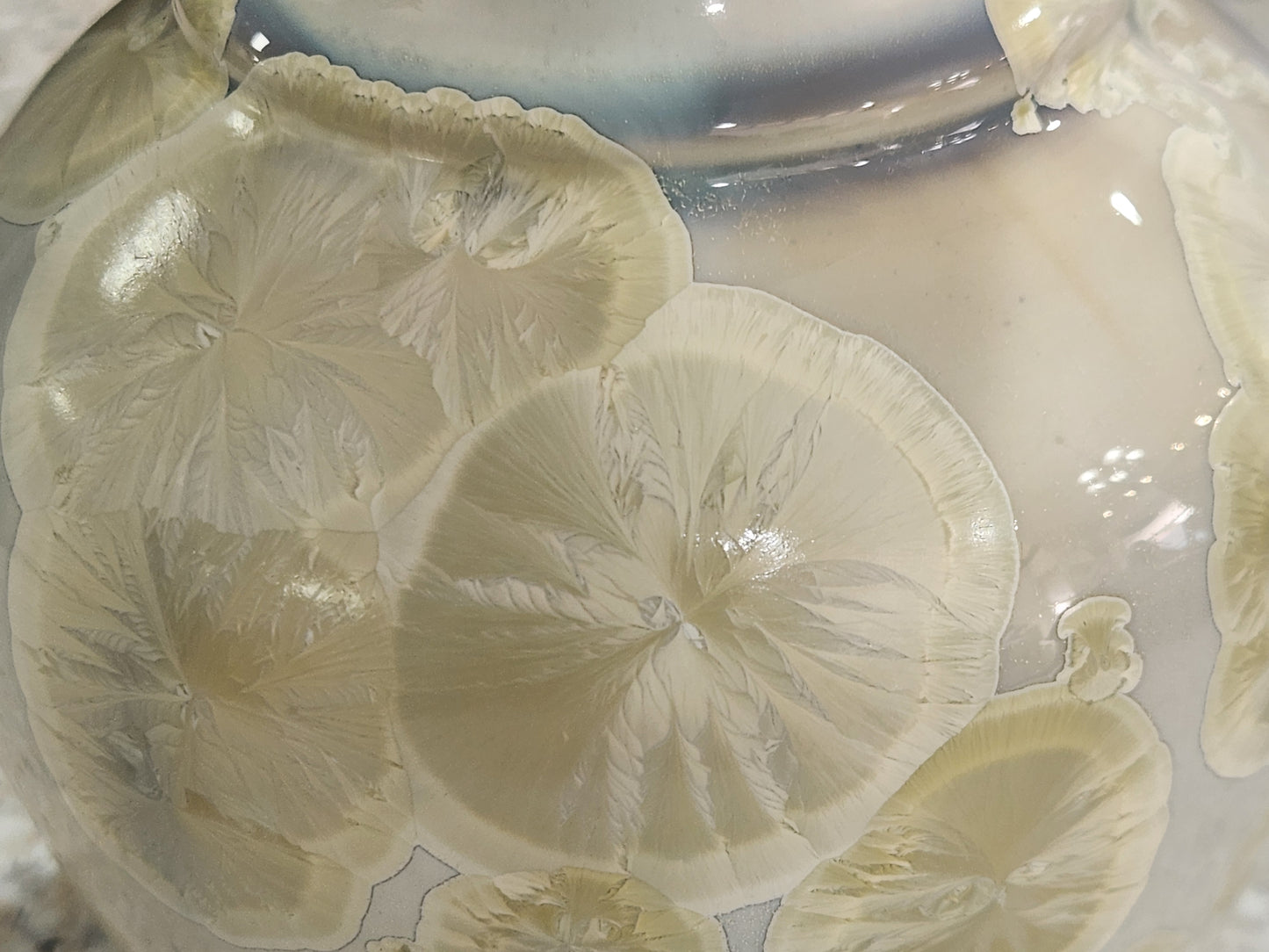 Golden crystals shown in close up of a large crystalline vase made n Melbourne.