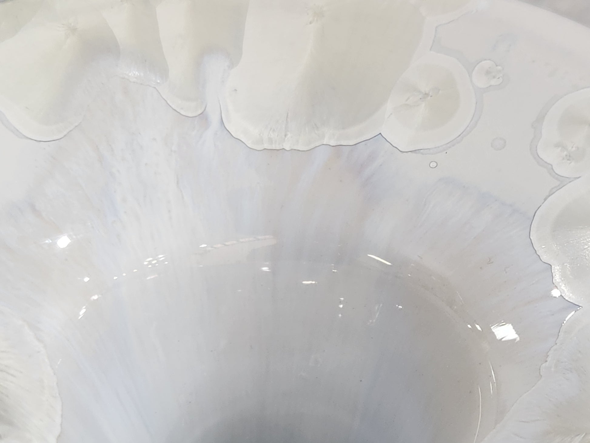 close up of opalized effect on the inside neck of this crystalline vase