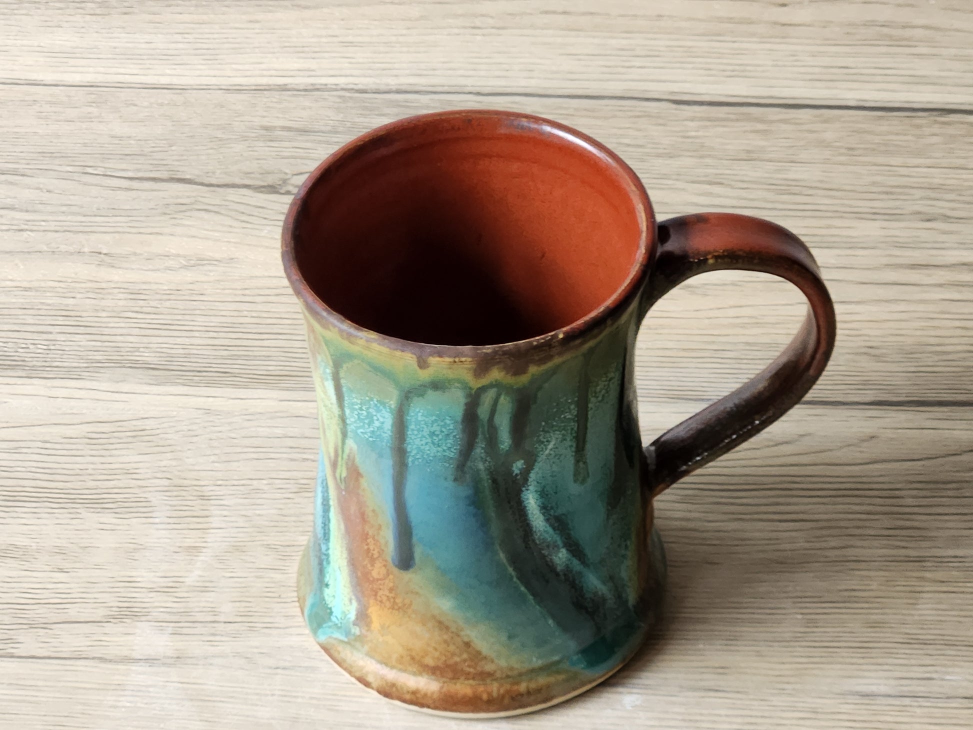 Rustic handmade pottery mug for coffee or tea with organic glaze