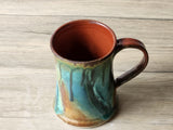 Rustic handmade pottery mug for coffee or tea with organic glaze