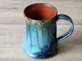 Artisan ceramic mug with speckled teal glaze, handmade in Melbourne studio