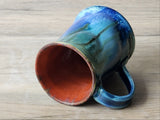 One-of-a-kind pottery mug with ocean green glaze and earthy brown accents