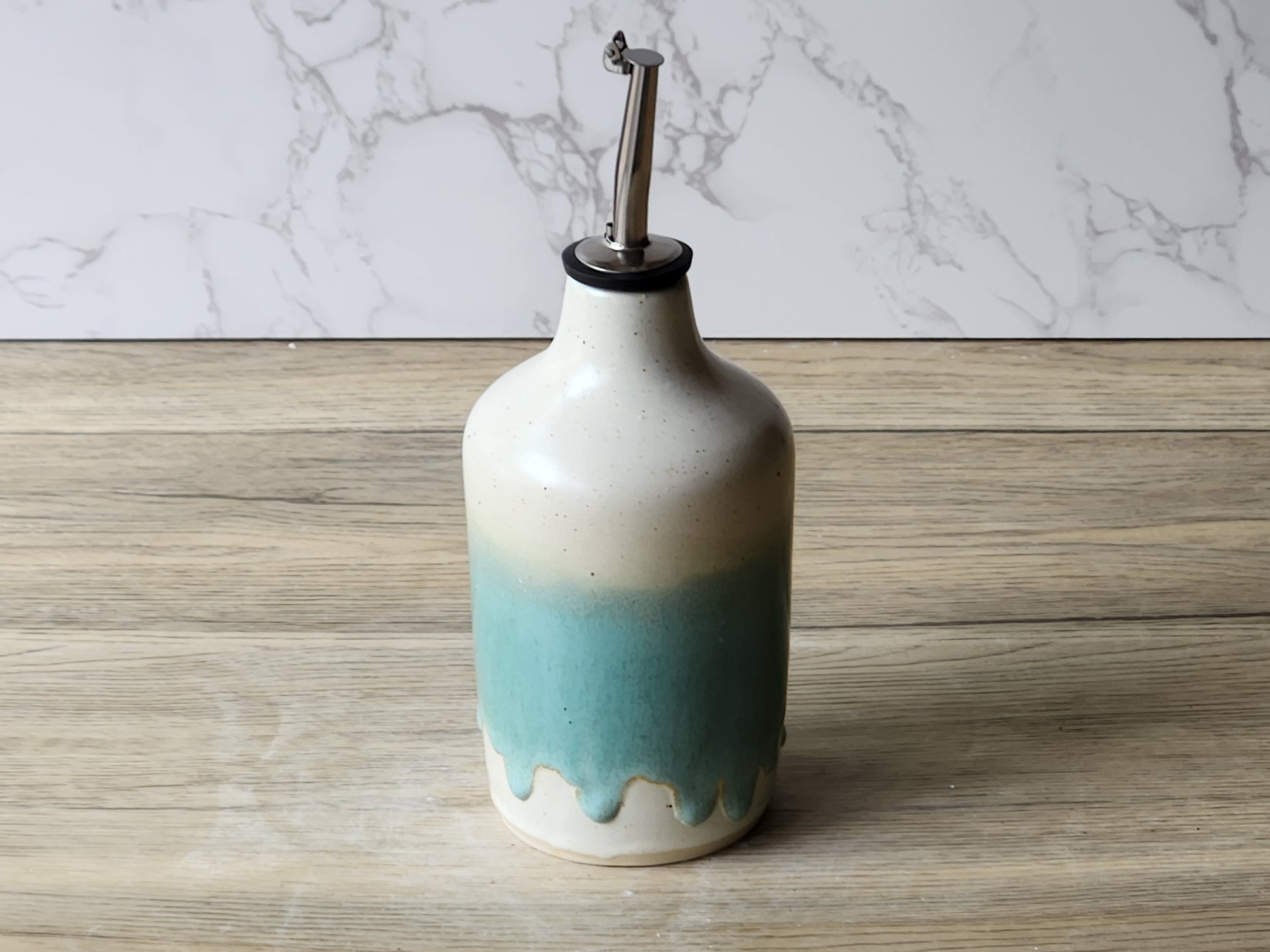 Ceramic kitchen oil dispenser bottle with mint green glaze and speckled finish