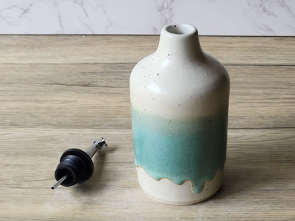 Green and cream glazed ceramic oil bottle with stainless steel pourer top
