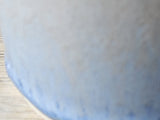 Close up of Refillable ceramic oil dispenser for olive oil, neutral glazed stoneware
