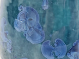 Close-up of blue crystalline glaze on handmade ceramic mug