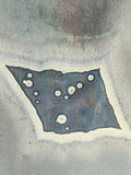 close up of an Experimental ceramic art pot with blue crystalline glaze