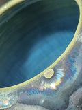 close up of the rim of a Sculptural handmade pottery vase with flowing crystals