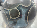 Close-up of oversized crystals on handmade galaxy glaze vase