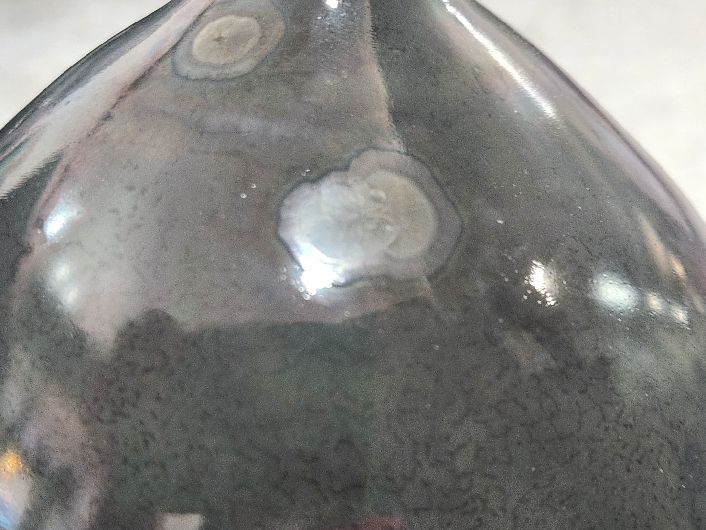 Detailed crystalline glaze texture on experimental ceramic vase