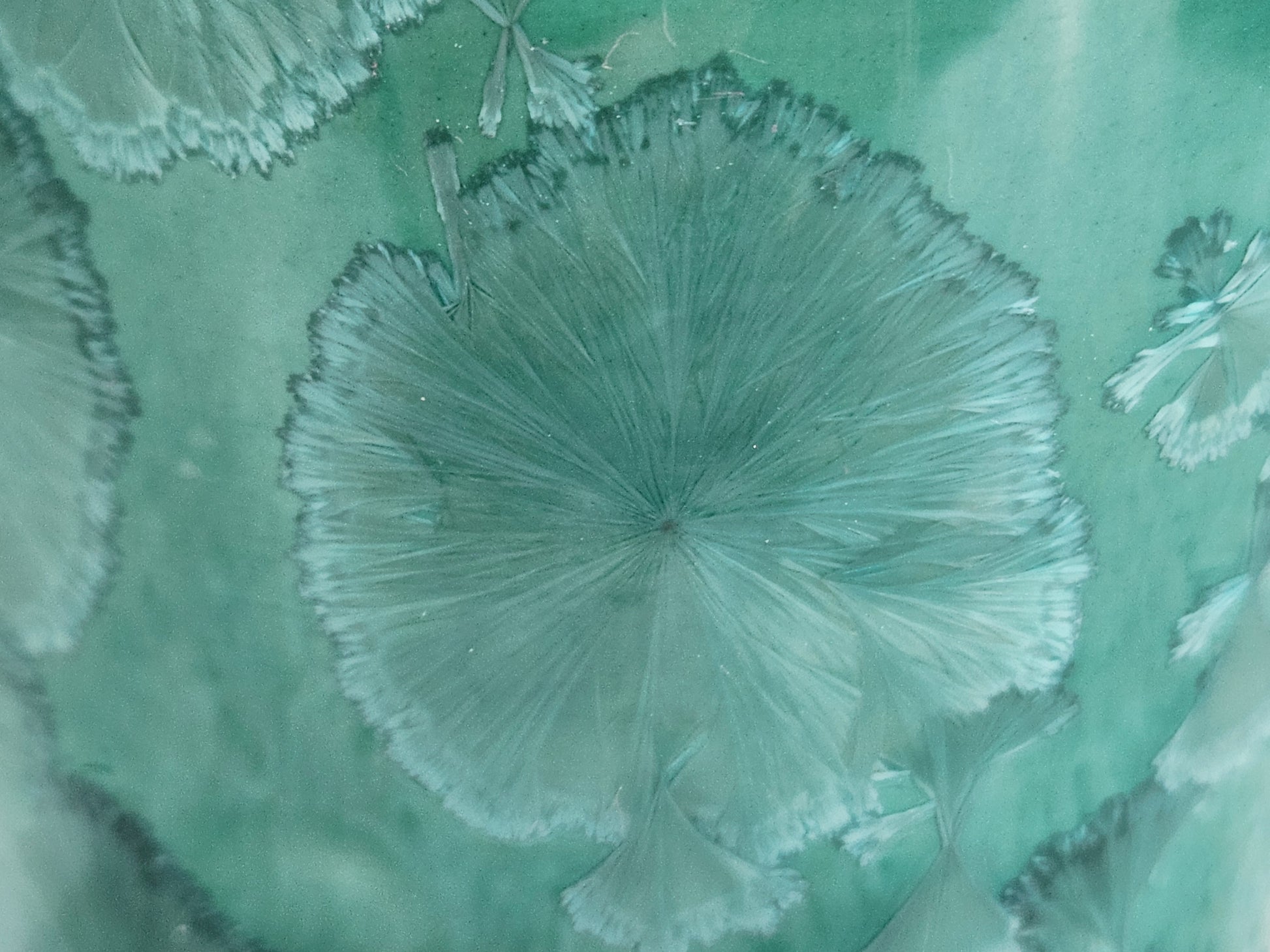 Clos up of the glaze on a Unique green porcelain vase gift for a pottery lover