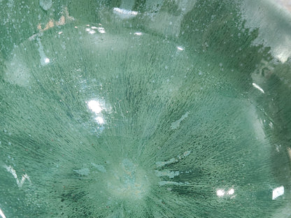 close up of glaze on a Handmade green pottery bowl for salads vegetables and shared dishes