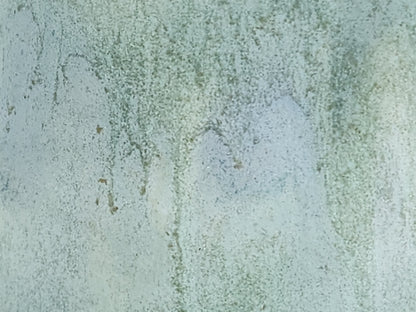 Close-up of mottled green and blue glaze on handmade jug