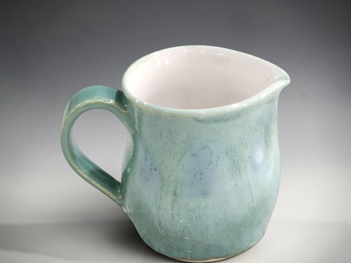 Handmade 250 ml milk jug with curved handle and pouring lip