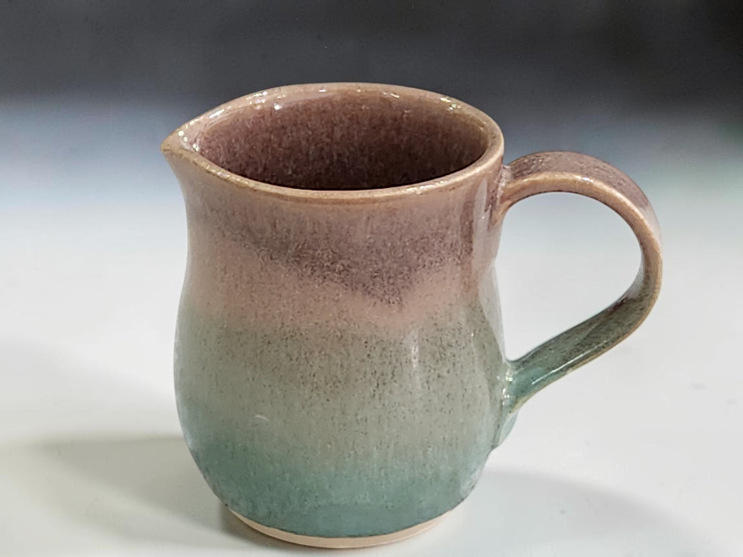 Handmade stoneware creamer jug with pouring lip