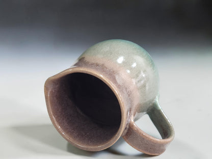 Small handmade ceramic jug for cream sauces or dressing