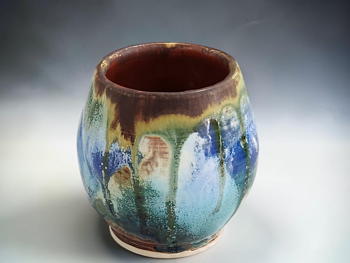 Australian handmade pottery tea cup with rounded handleless design