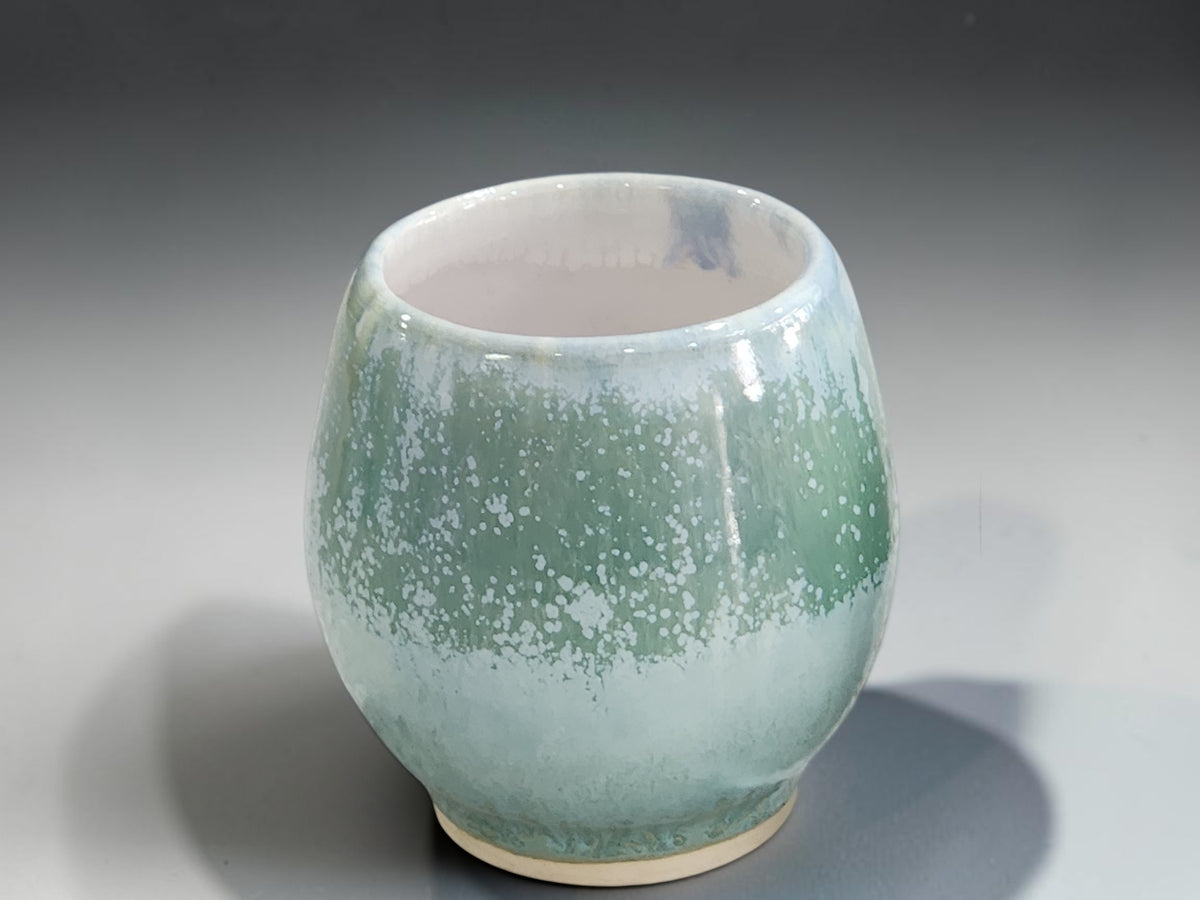 Two handleless 250ml ceramic tea cups, 8.5cm high by 8cm wide