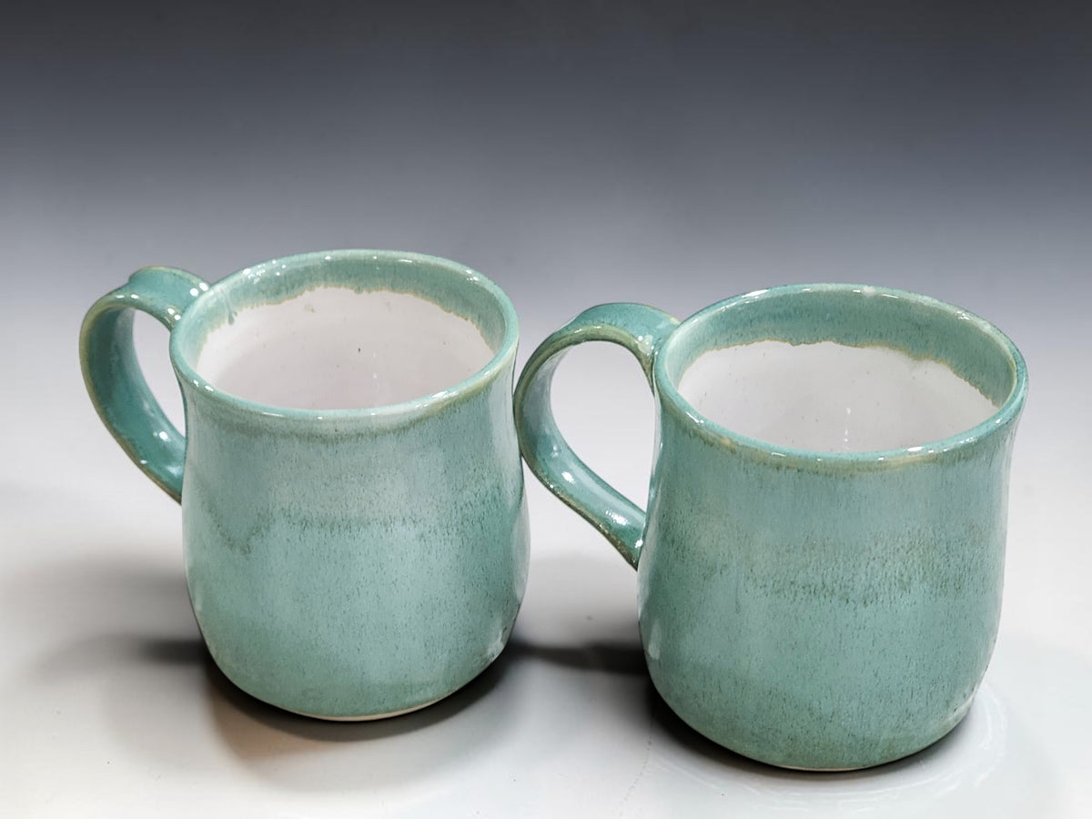 Australian handmade ceramic mugs with glossy spearmint glaze and white interior