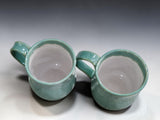 Wheel thrown pottery mugs in soft green glaze for coffee, tea and hot chocolate
