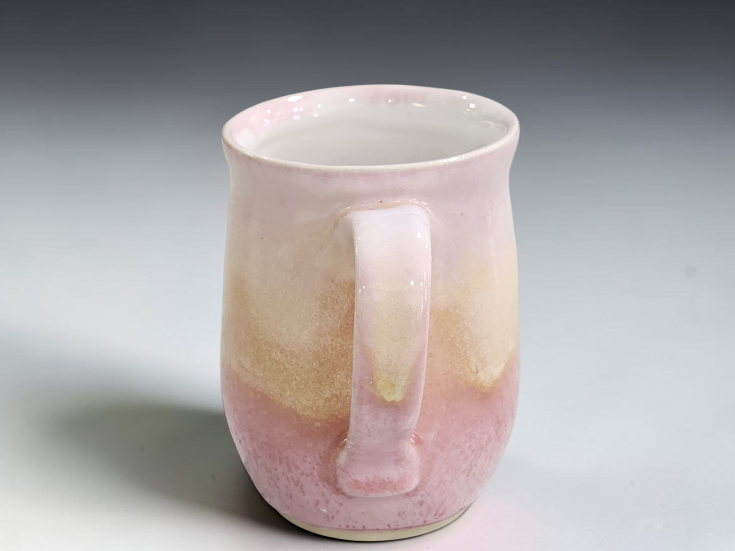 Handmade ceramic mug showing natural glaze movement and tonal variation