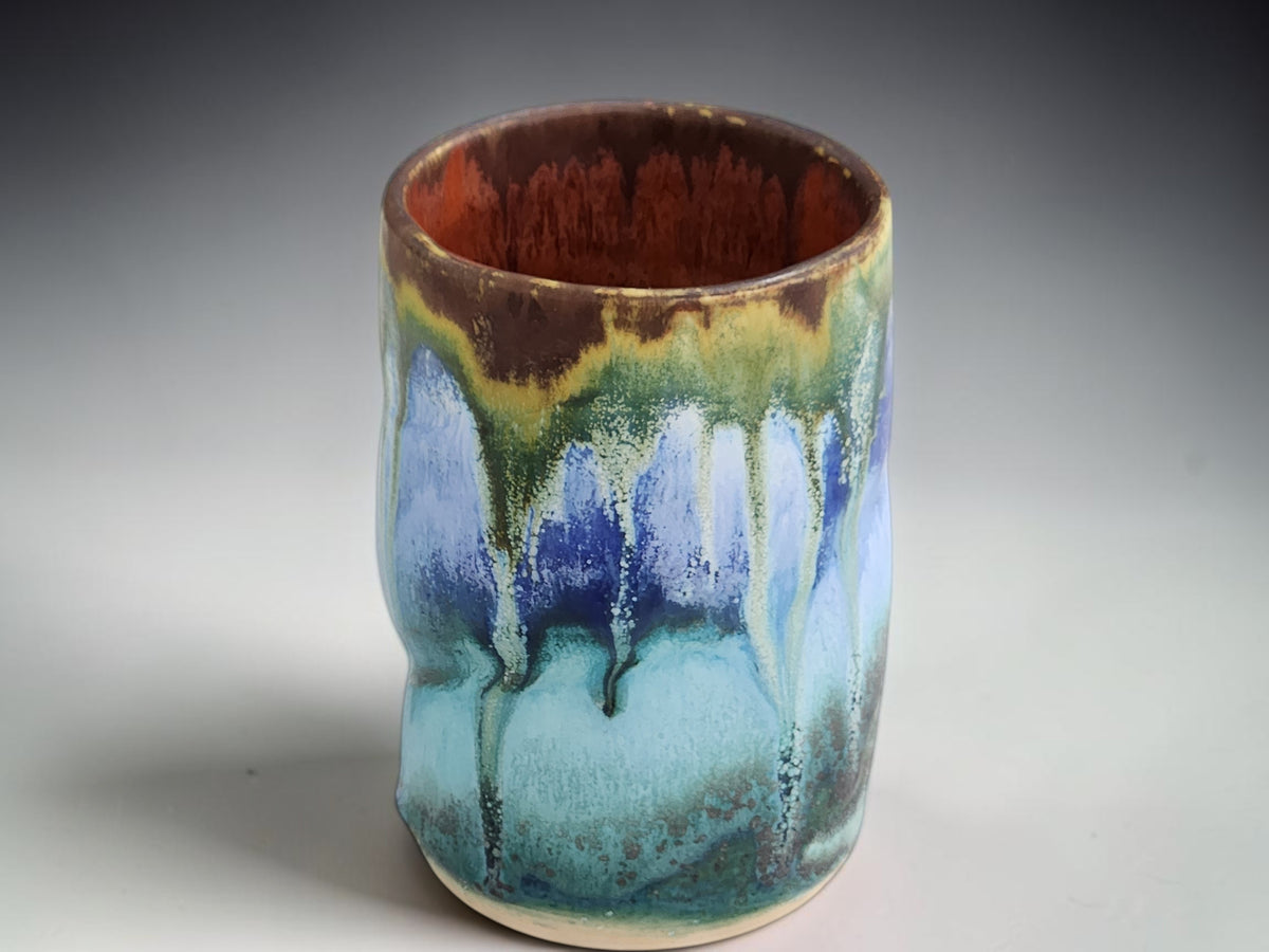 Rustic pottery tumbler with layered spray-applied glazes by Buxton Pottery