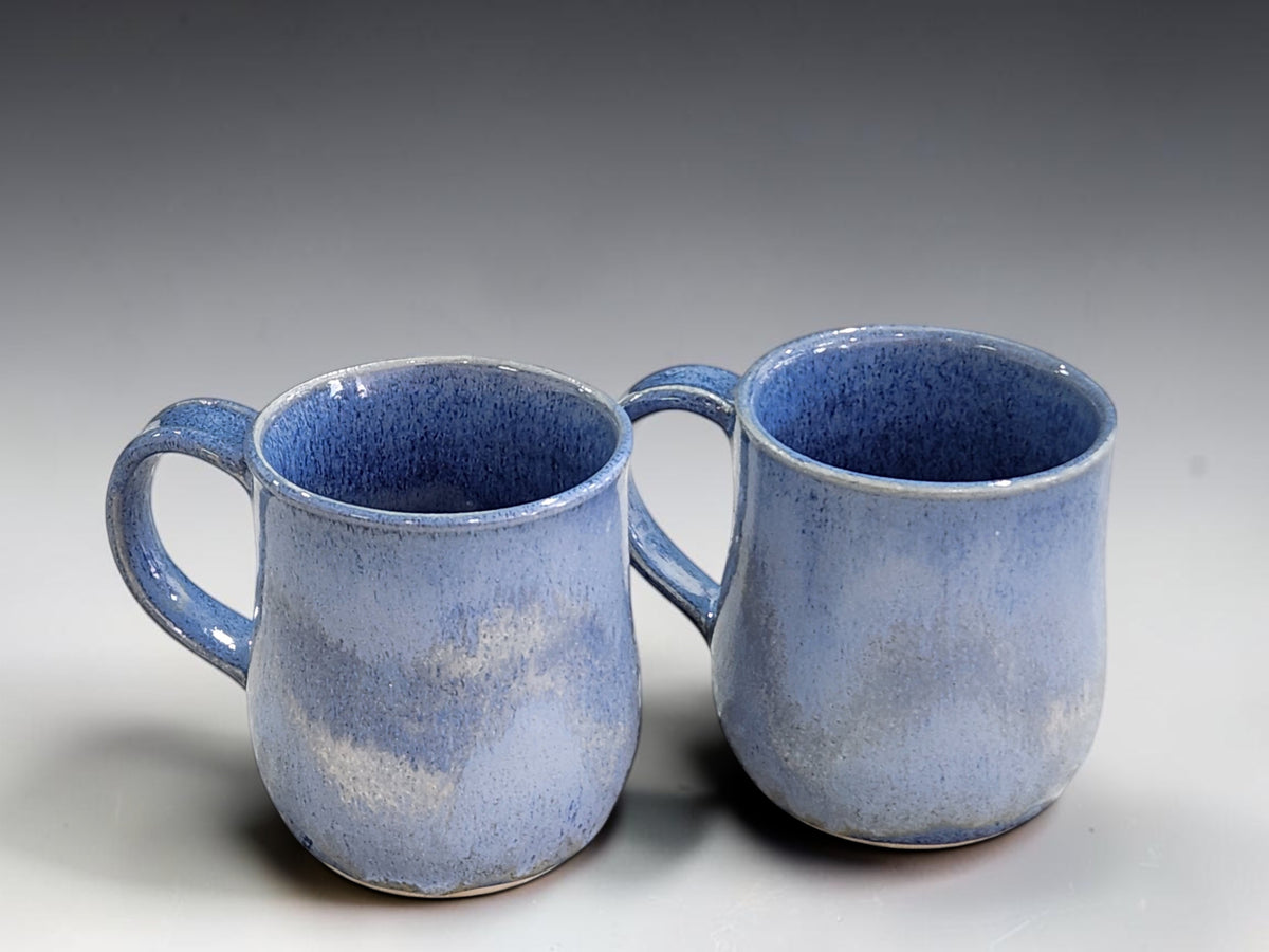 Handmade 350ml mugs in soft blue and navy artisan glaze
