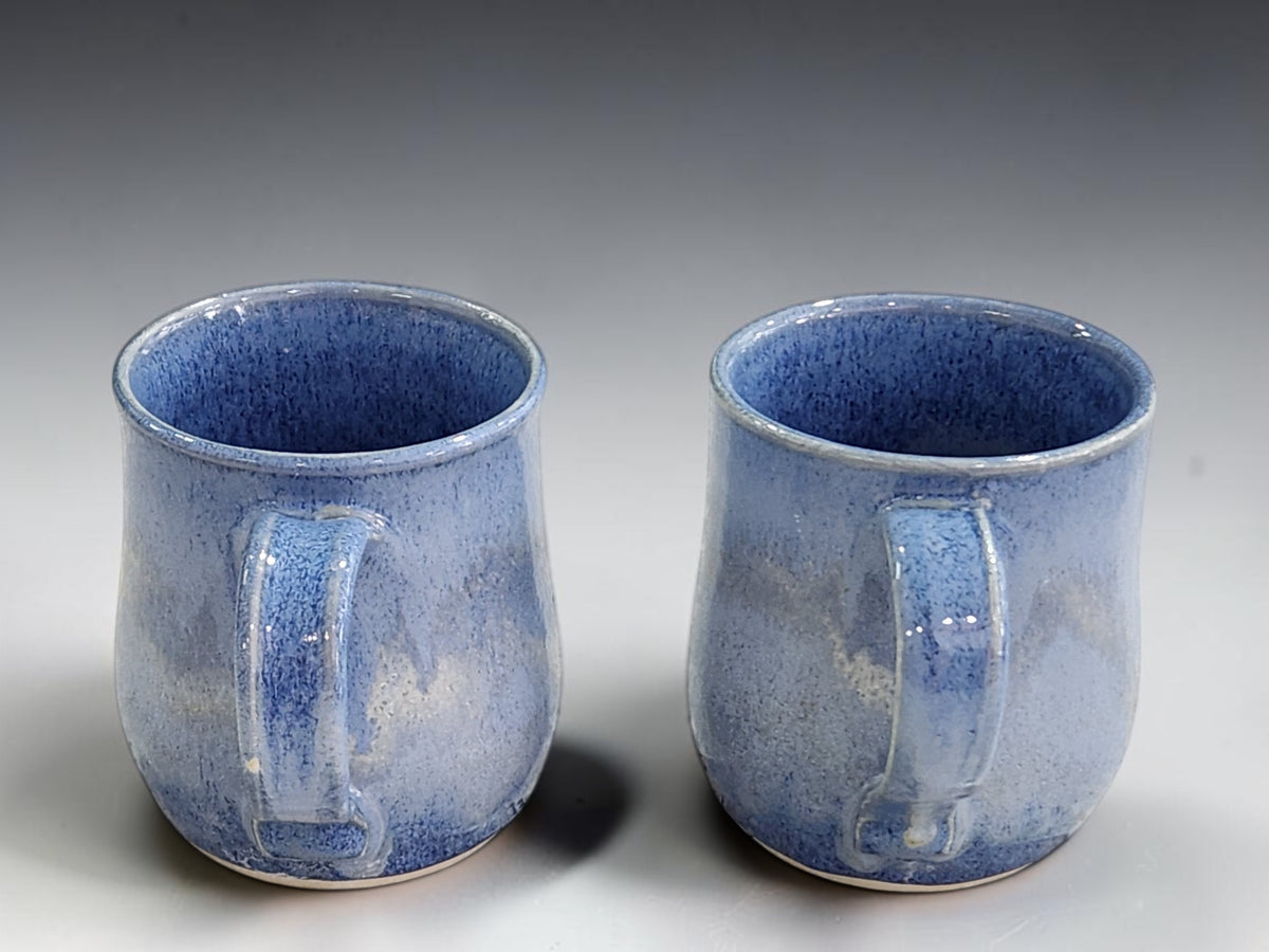 Matching pair of blue pottery mugs for everyday coffee, tea or hot chocolate