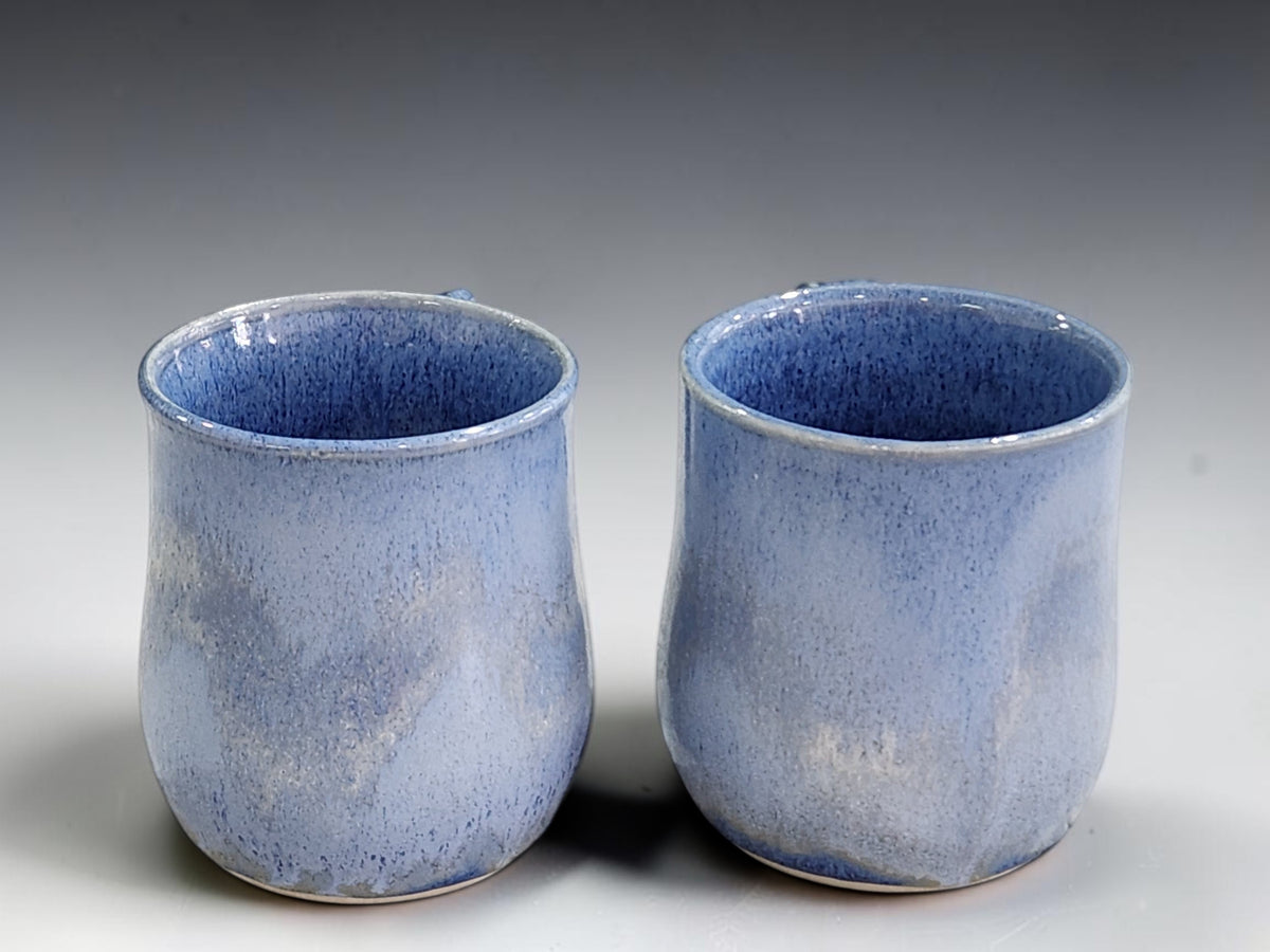 Two 350ml ceramic mugs showing comfortable hand-shaped handles