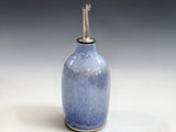 Blue glazed stoneware olive oil dispenser with stainless steel spout
