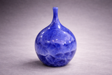Unique handmade ceramic bud vase in deep blue crystalline glaze, Australia