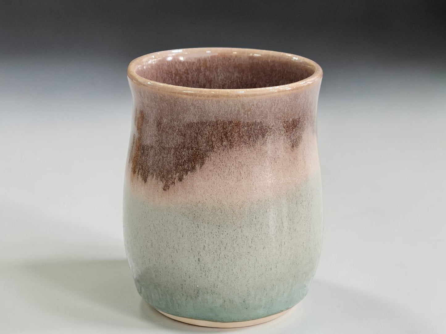 Glossy oatmeal interior of handmade Australian pottery mug