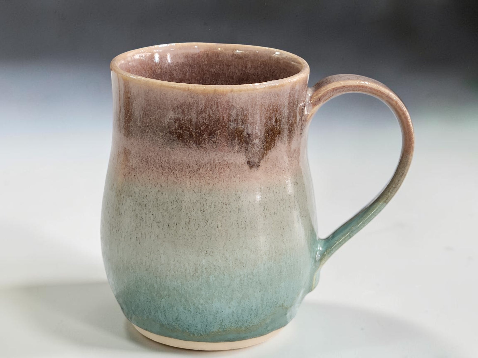 Large handmade stoneware mug with comfortable curved handle