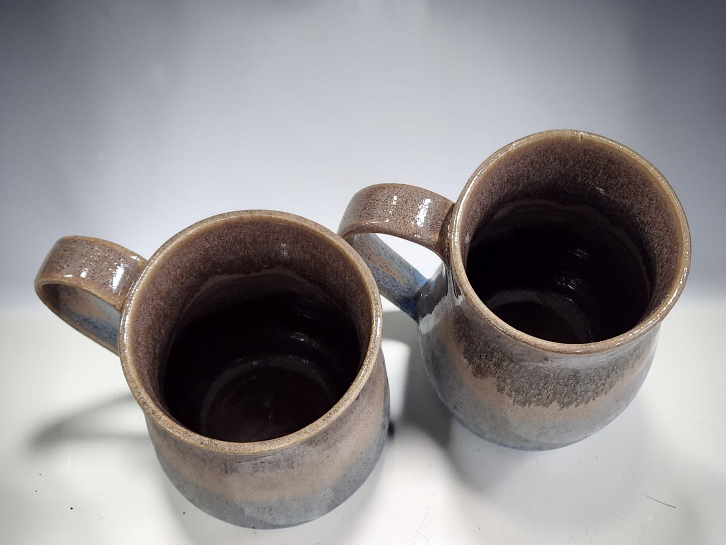 Rustic ceramic mugs in oatmeal and blue glaze, handmade pottery drinkware from Melbourne studio