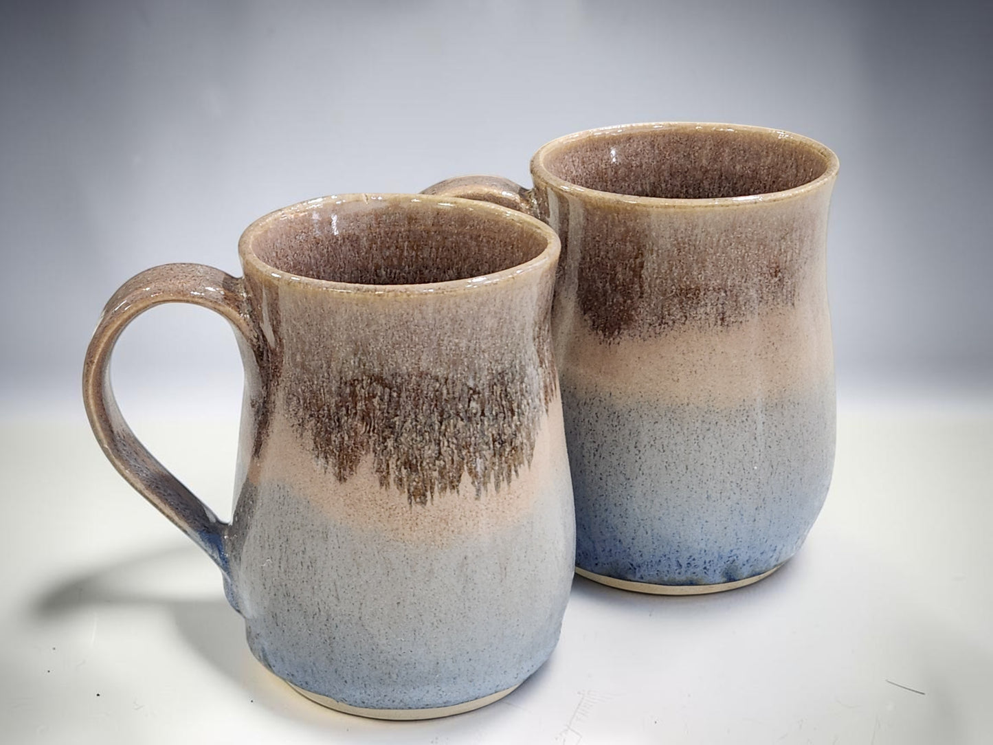 rustic handmade mugs with blue and oatmeal glaze, high-fired pottery mugs for coffee or tea