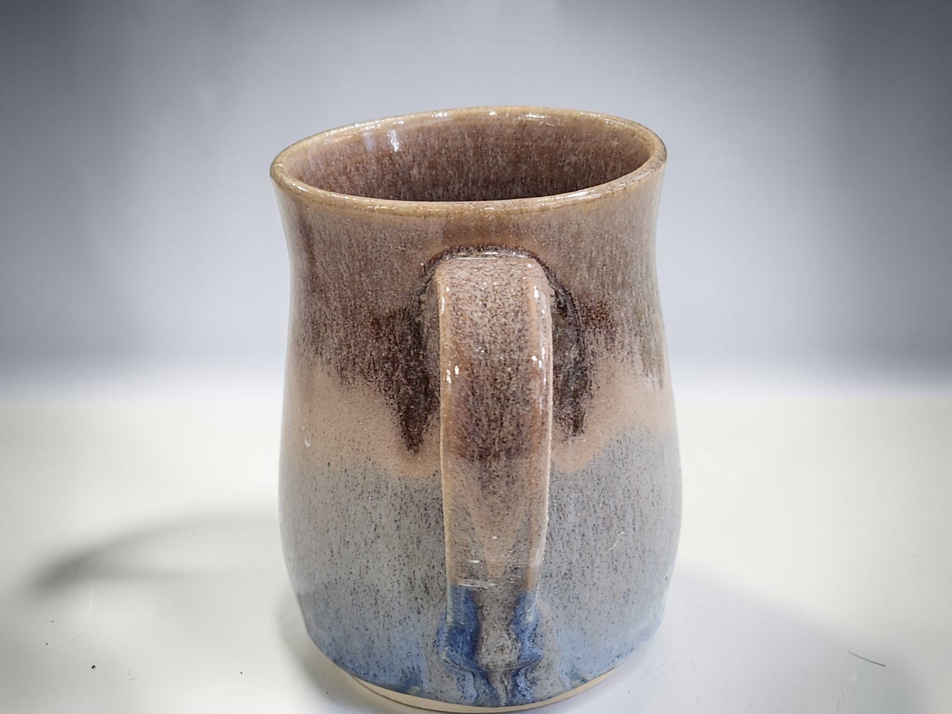 Artisan handmade mug with earthy oatmeal glaze and blue tones, 400 ml pottery mug Australia