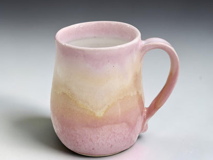 Australian stoneware coffee mug with soft blush-pink and cream glaze