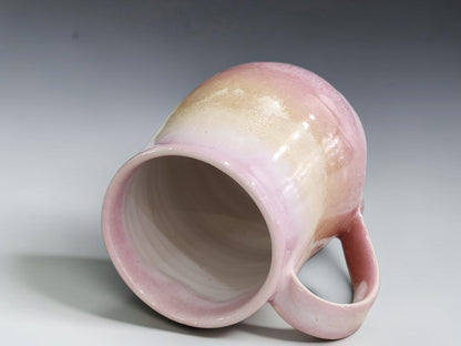 Side view of handmade 400ml mug showing its slender pink handle